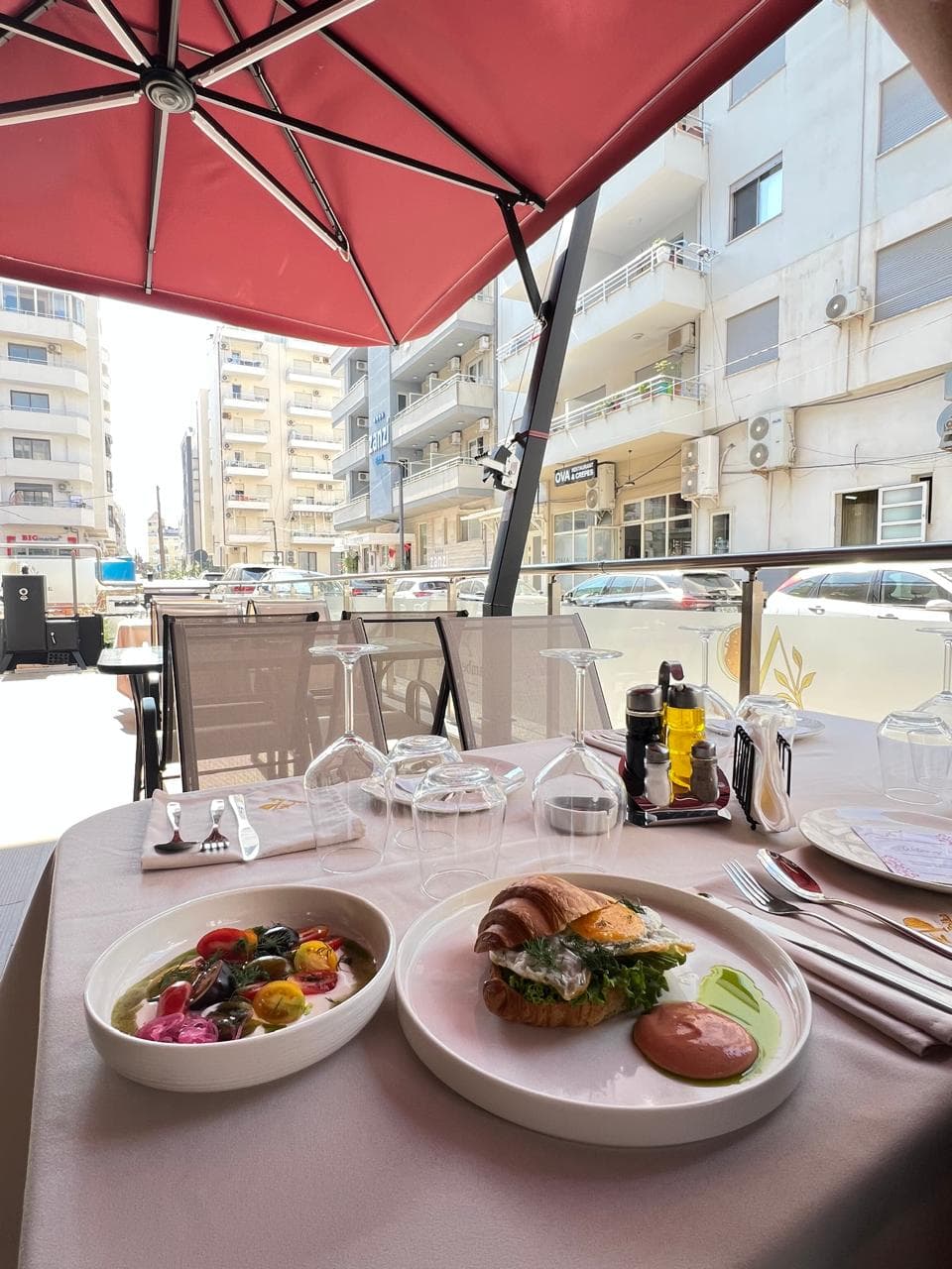 Lunch on the Amber Polka terrace under a red umbrella